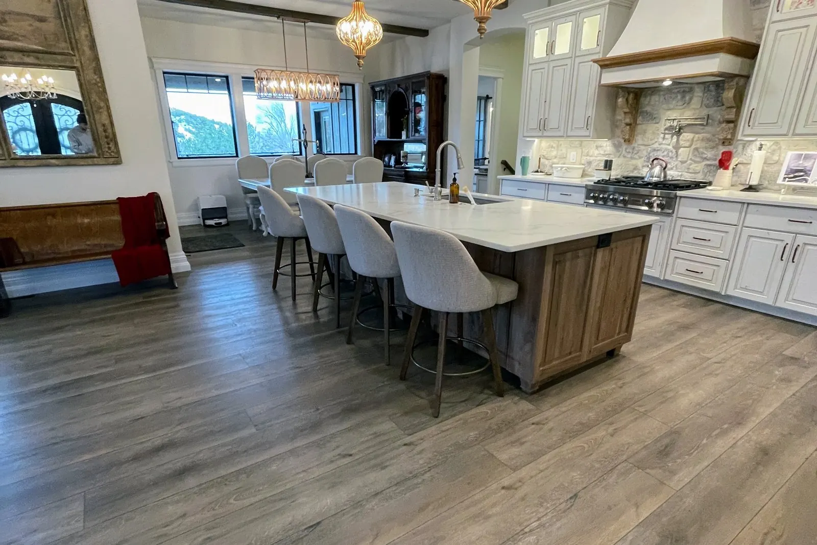 Wide-plank luxury vinyl flooring installed in a Pocatello kitchen by Pocatello Flooring
